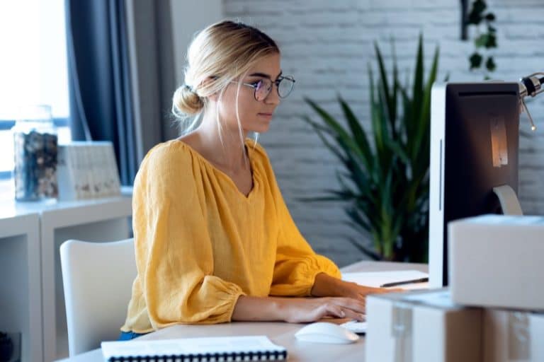 Pretty freelance business woman seller working with computer in her startup small business